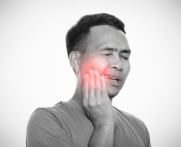 Man with severe toothache and facial pain needing root canal